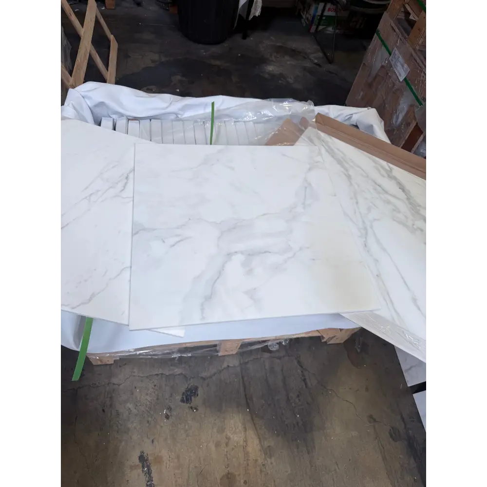 White marble-patterned tiles from Calacatta Gold Select Gold Marble 24x24 collection