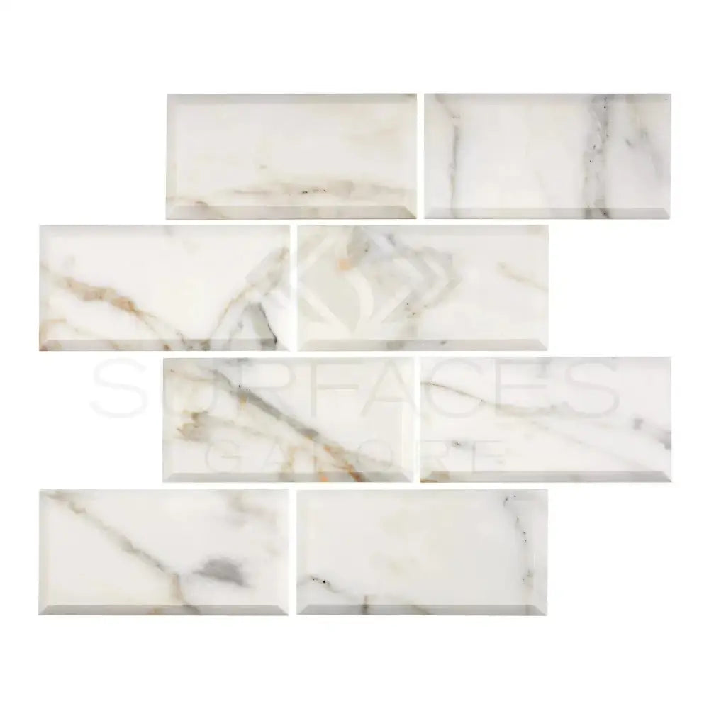 Marble-patterned rectangular tiles from Calacatta Gold Select with deep bevel and polished finish