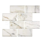 Marble-patterned rectangular tiles from Calacatta Gold Select with deep bevel and polished finish