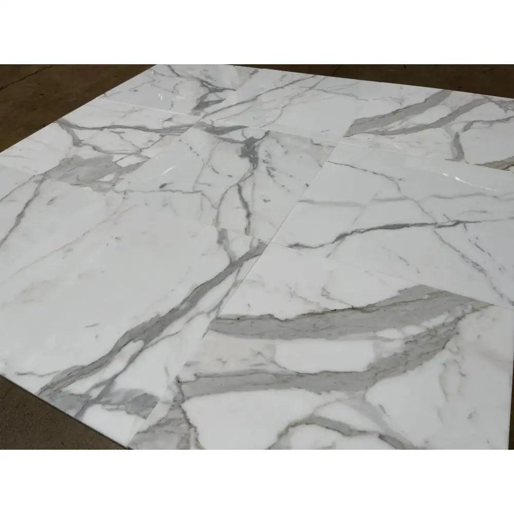 White marble tile pattern for Calacatta Gold Select Gold Marble surface