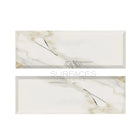 Rectangular Calacatta Gold Select marble-patterned tiles with deep-beveled polished-honed finish