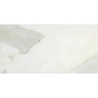 Creamy marble-patterned tile from Calacatta Gold Select Gold Marble 6X12 collection
