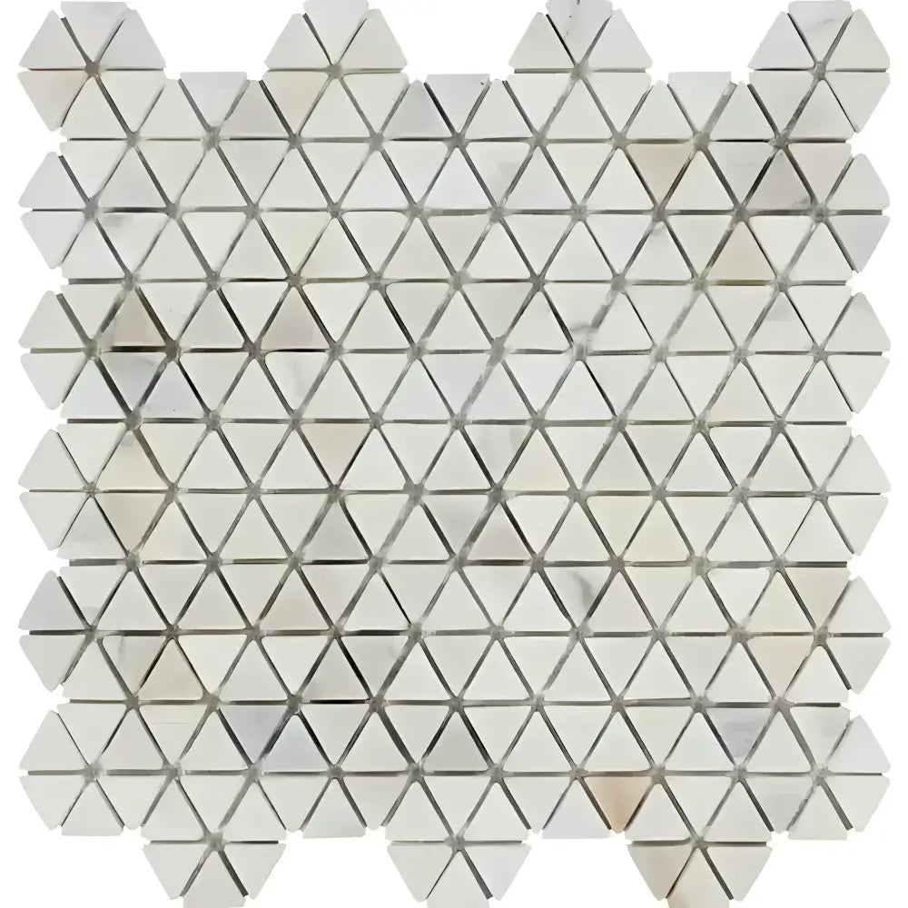 White triangular mosaic tile sheet from Calacatta Gold Select Gold Triangular Hexagon Marble Tile Tumbled