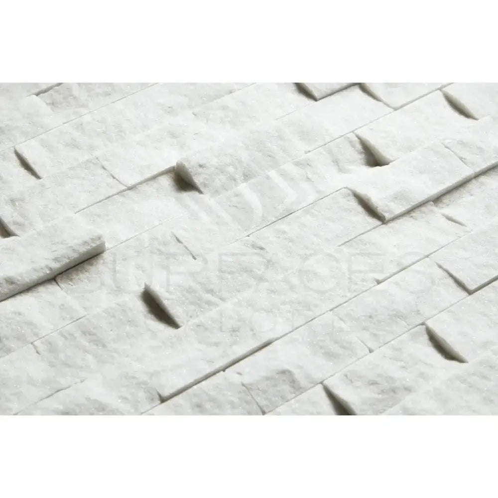 White stacked stone wall cladding featuring Carrara White Royale marble mosaic tile