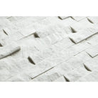 White stacked stone wall cladding featuring Carrara White Royale marble mosaic tile