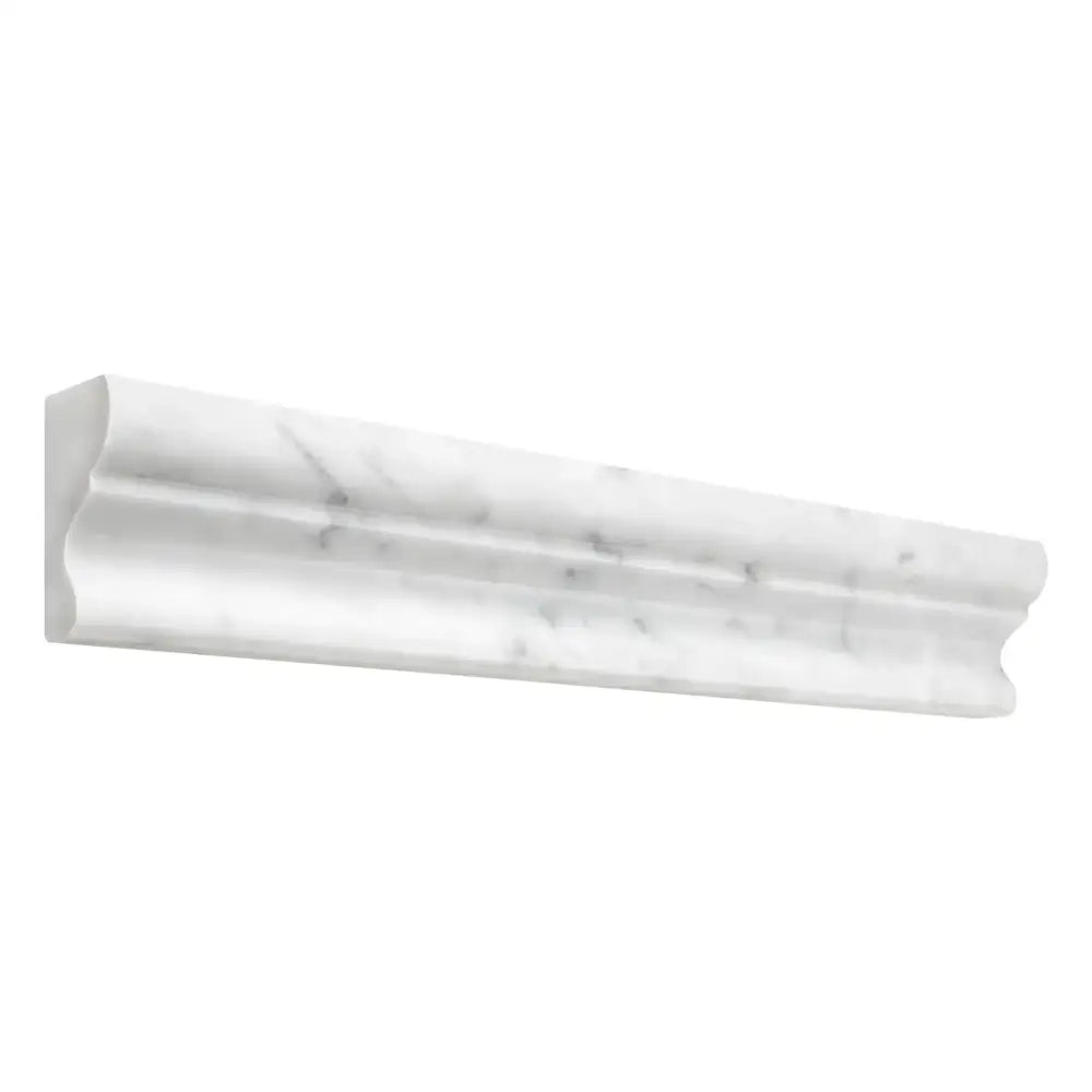 White marble chair rail molding for elegant interior decor in Carrara White Royale 2X12 Crown Mercer Molding Liner