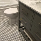 Gray bathroom vanity with marble top in Carrara White Royale 2x2 mosaic tile