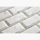 White marble beveled subway tiles from Carrara White Royale 2X4 mosaic collection