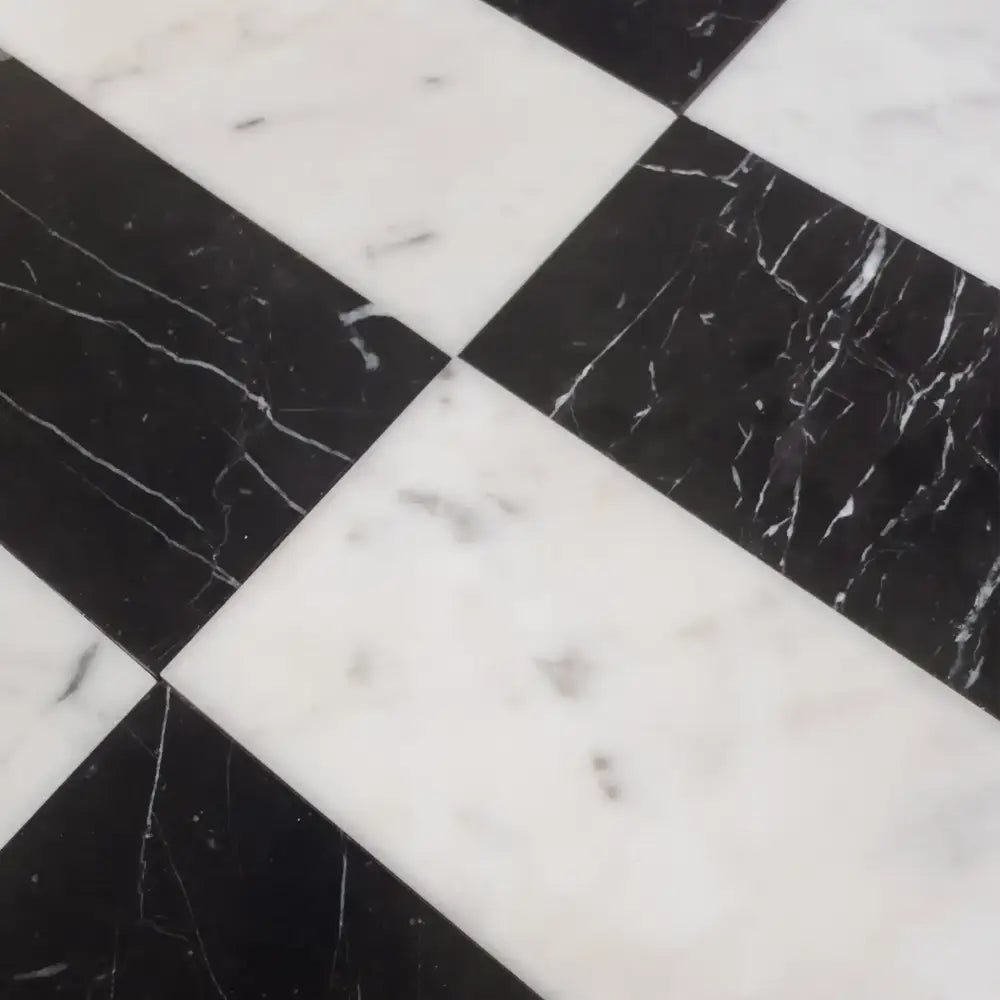 Black and white marble tile pattern from Carrara White Royale and Nero Marquina Prestige set
