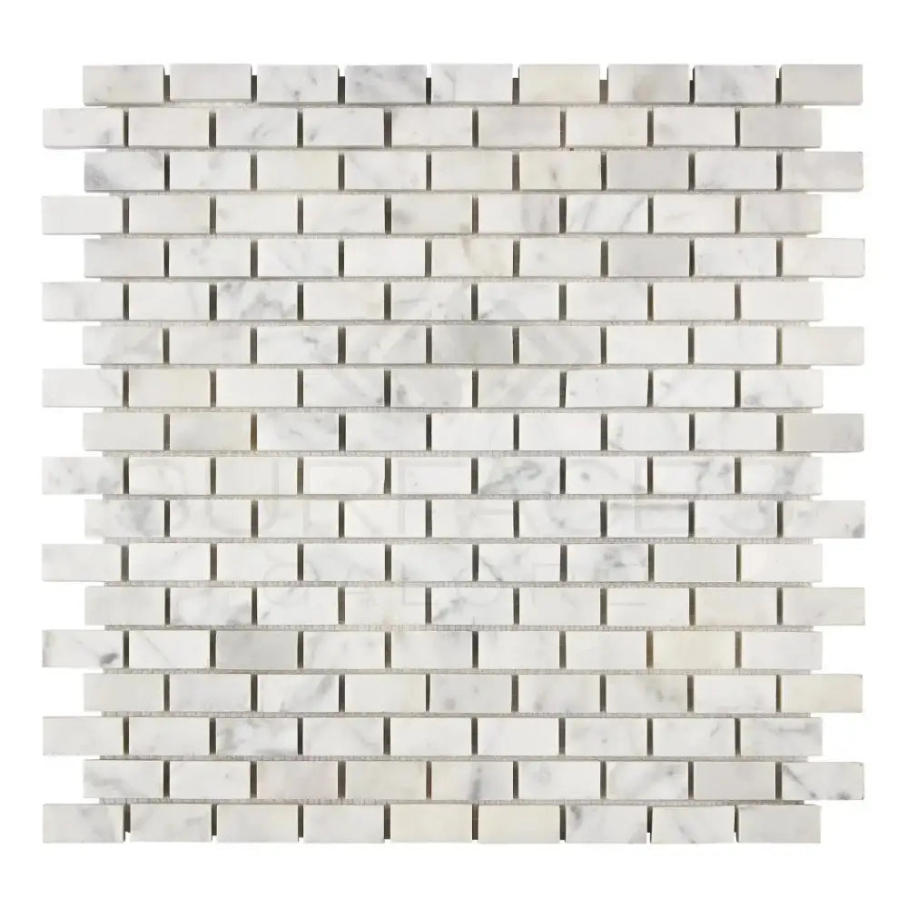 White marble mosaic tile in Carrara White Royale Herringbone pattern for elegant flooring