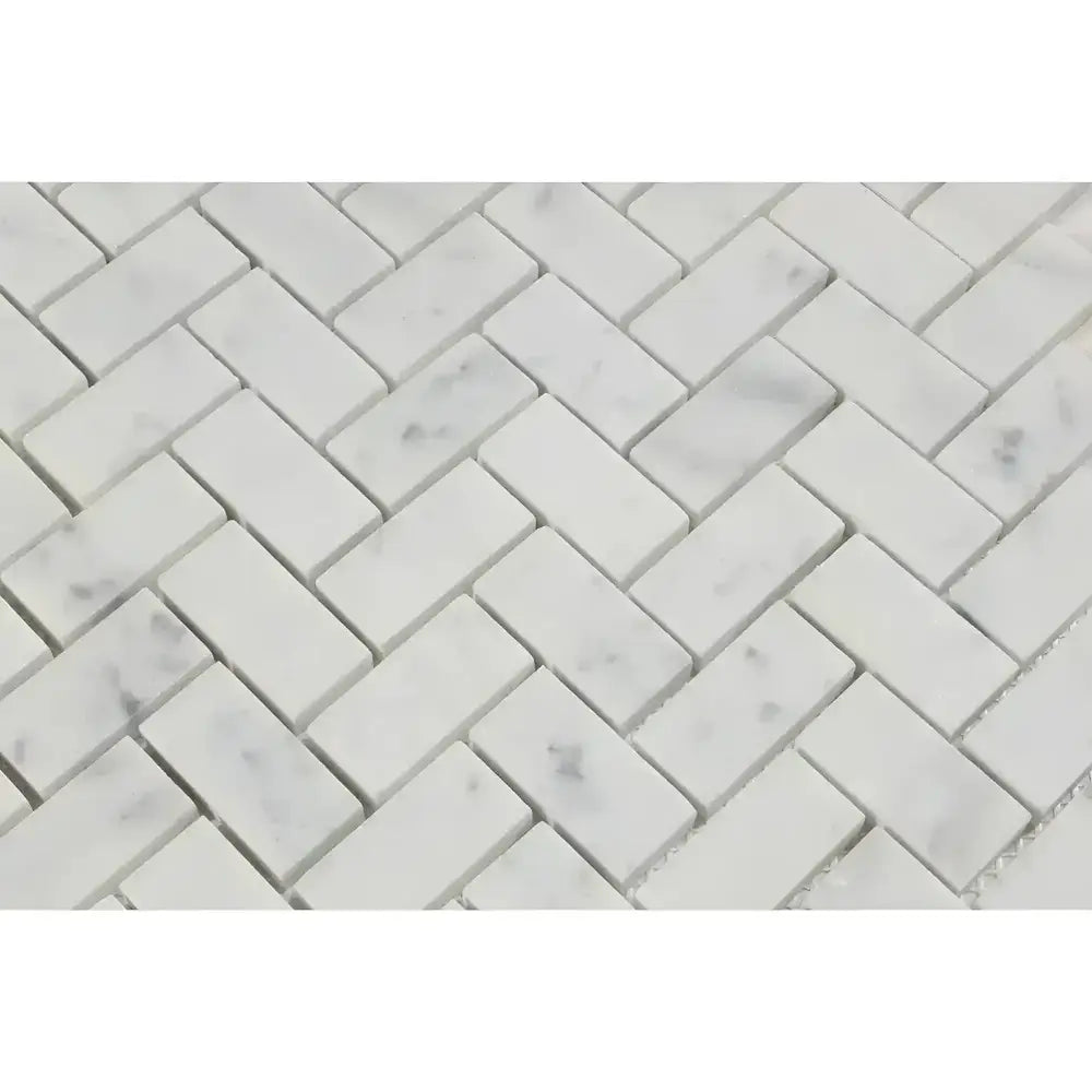 White marble herringbone tile pattern featuring Carrara White Royale mosaic marble tiles
