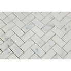 White marble herringbone tile pattern featuring Carrara White Royale mosaic marble tiles