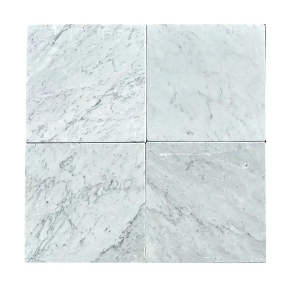 Four Carrara White Royale marble tiles 12x12 Tumbled displayed for product listing