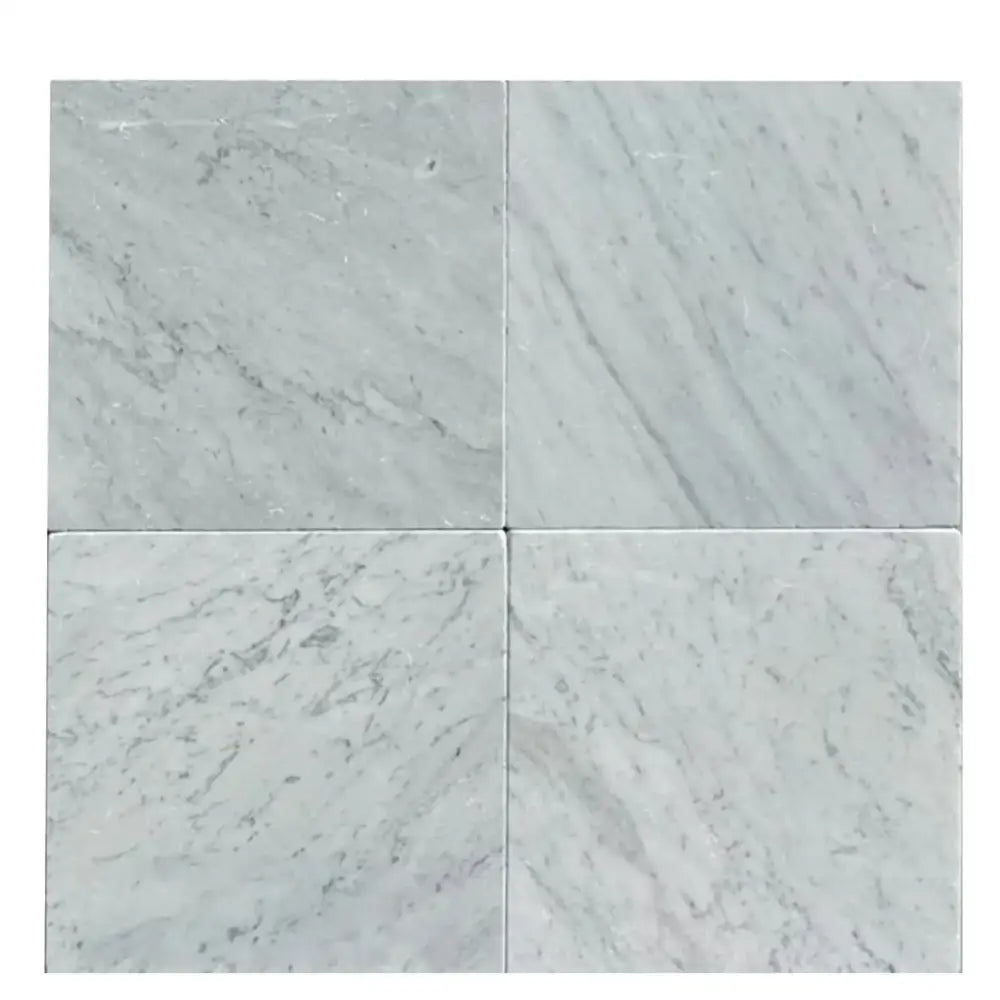 Four Carrara White Royale Marble 12x12 tumbled tiles showcasing elegant white marble texture