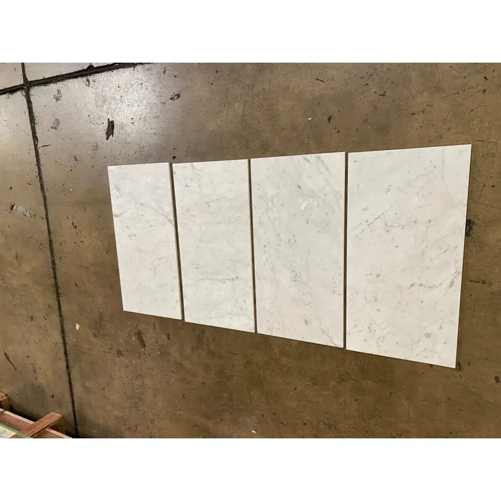 Four white Carrara marble tiles in 12x24 polished or honed finish