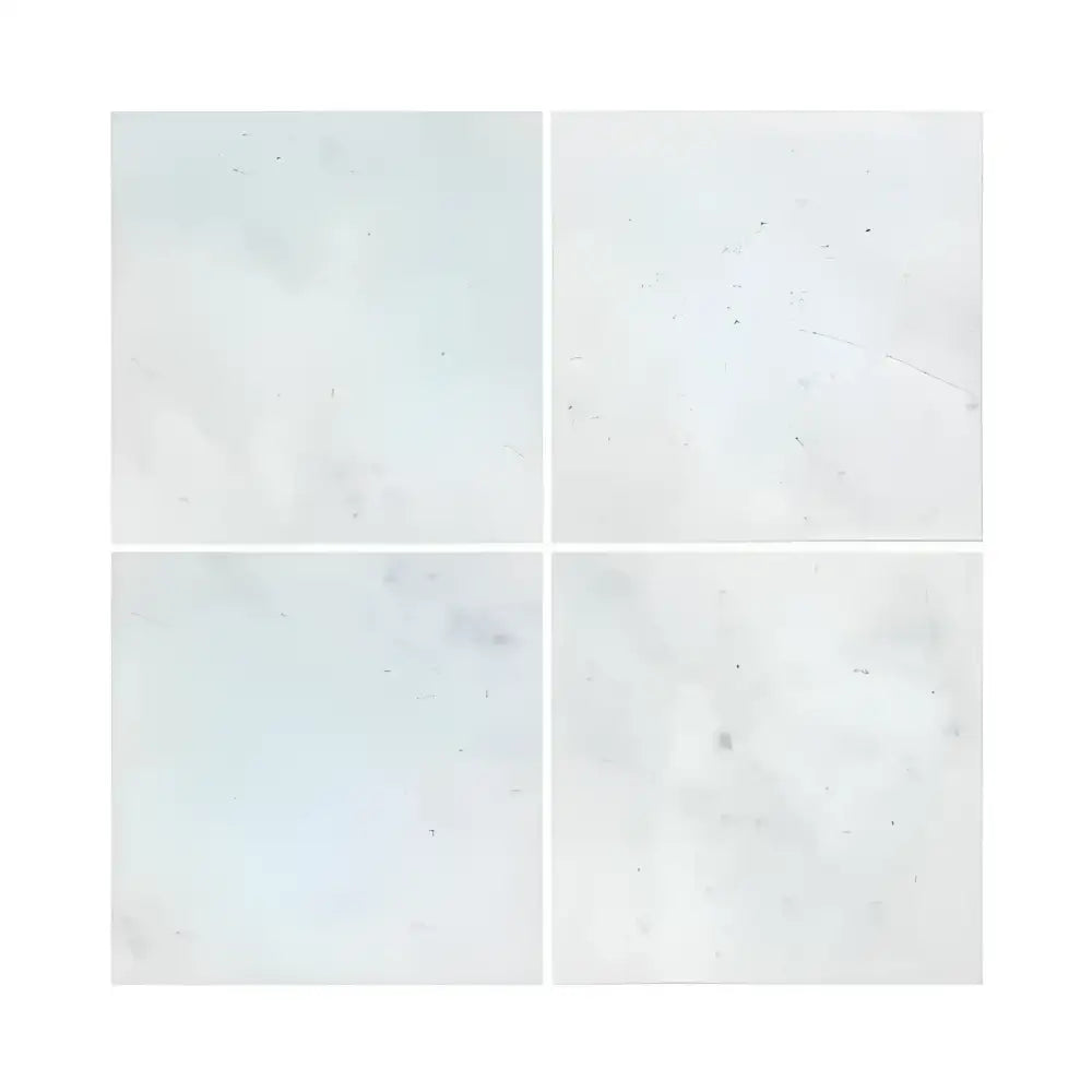 Four white square Carrara White Royale marble tiles with polished or honed finish