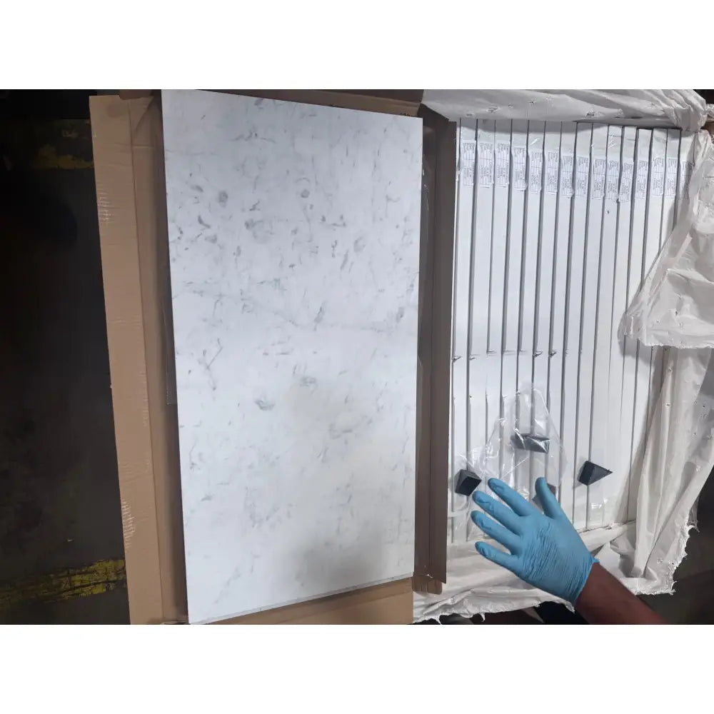 Boxed Carrara White Royale marble-patterned tiles for flooring or walls