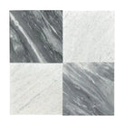 Four Carrara White Royale Marble 3x6 tumbled tiles with elegant marble pattern
