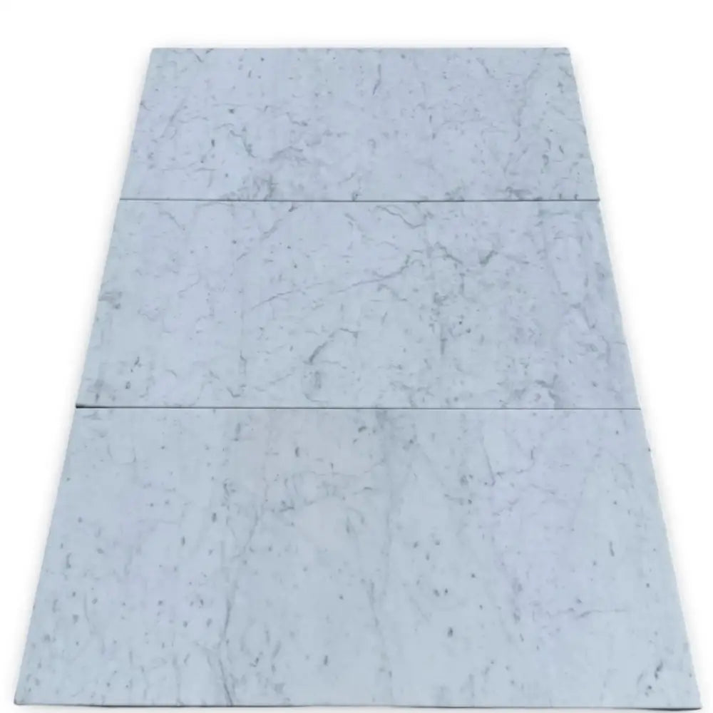 Carrara White Royale Marble 3X6 Tumbled marble-patterned floor tiles