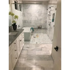 Modern marble bathroom featuring Carrara White Royale Marble 3X6 Tumbled tiles