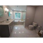 Modern bathroom interior featuring Carrara White Royale Marble 3X6 Tumbled tiles