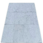 Marble-patterned floor tiles from Carrara White Royale Marble 4X12 polished or honed