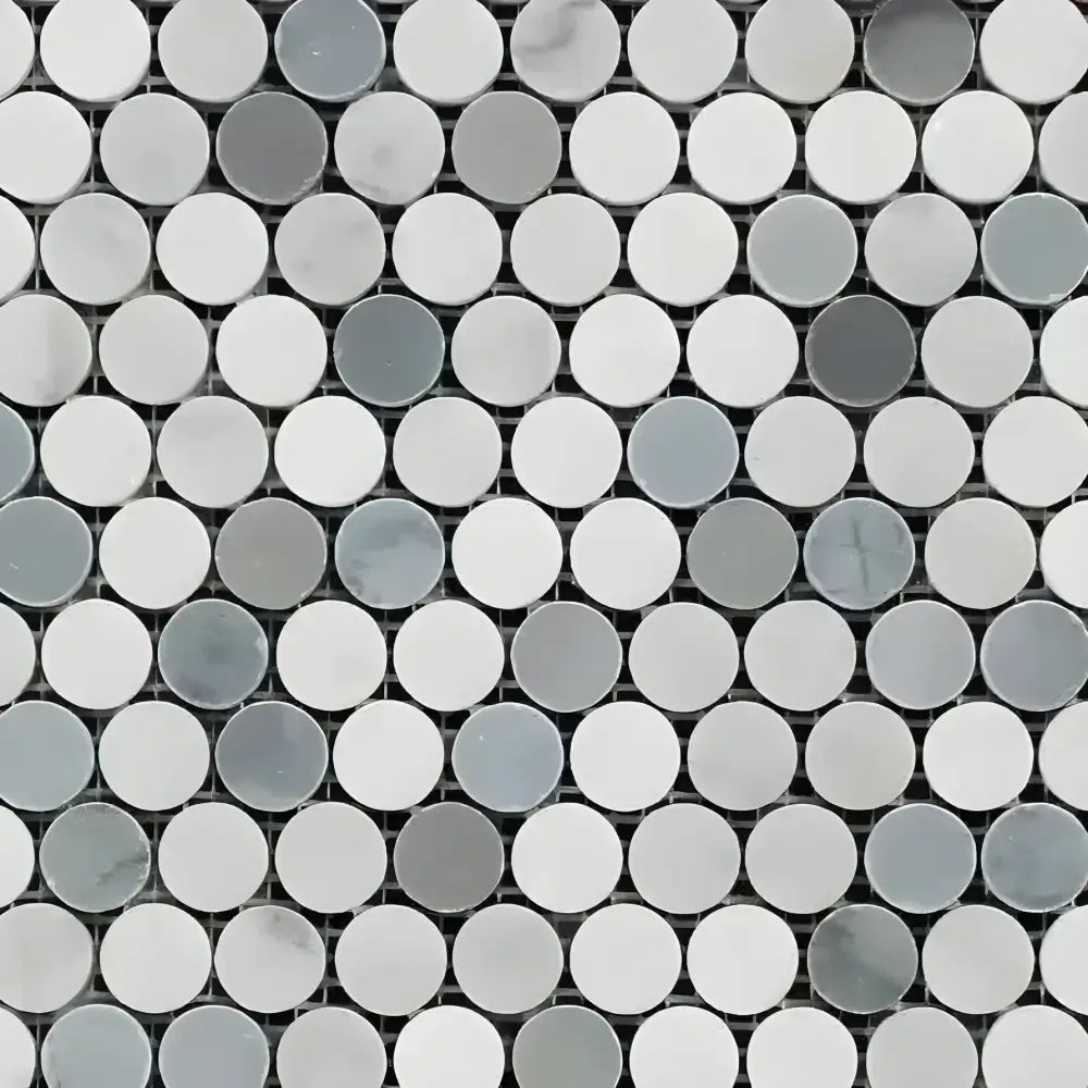 Light-toned mosaic marble tiles in white, grey, and blue for Carrara White Royale Penny-Round Mosaic