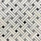 Mosaic tile with herringbone pattern of light rectangular pieces and dark gray black squares