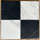 Four square Bardiglio Prime and Calacatta Gold marble tiles in a checkerboard pattern