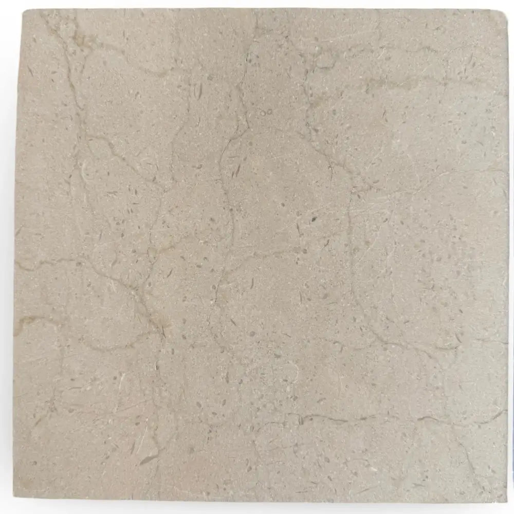 Square beige marble tile from Checkerboard Bardiglio Prime and Crema Marfil Set