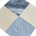 Four square marble tiles from Checkerboard Bardiglio Prime and Crema Marfil Set