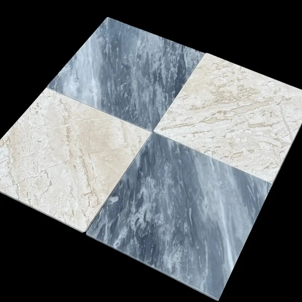 Four marble-patterned tiles from Checkerboard Bardiglio Prime and Diano Royal Marble 12X12 Set