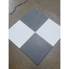 Gray and white checkered marble tiles from the Checkerboard Bardiglio Imperiale and Bianco Dolomite 12X12 Set