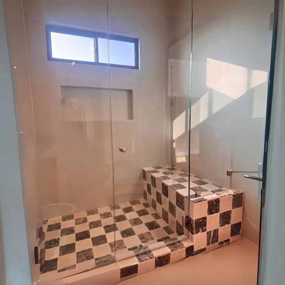 Checkerboard-tiled shower stall with Bardiglio Prime Imperiale and Aurora White Marble