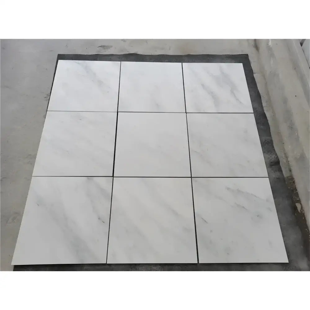 Nine white marble tiles in a Checkerboard Bardiglio Prime Marble and Aurora White Aurora Marble set