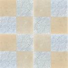 Alternating marble and tan square tiles from Checkerboard Bianco Carrara and Crema Marfil set