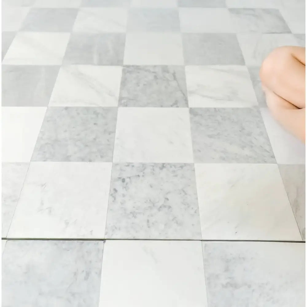 Checkerboard marble floor featuring Carrara White Royale and Oriental White Aurora tiles