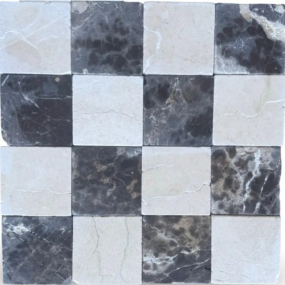 Checkerboard pattern of Crema Marfil Select and Emperador Dark Oro marble tiles