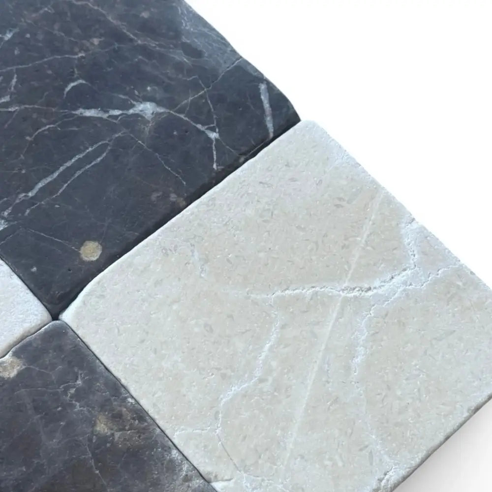 Black and white marble tiles in Checkerboard Crema Marfil Select and Emperador Dark Oro Tumbled Set
