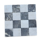 Checkerboard pattern of Crema Marfil Select and Emperador Dark Oro marble tiles