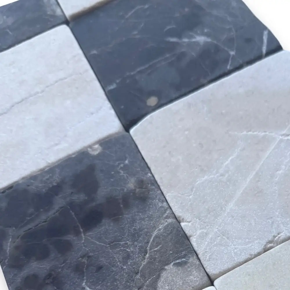 Black and white marble tiles from Checkerboard Crema Marfil Select and Emperador Dark Oro Tumbled Set