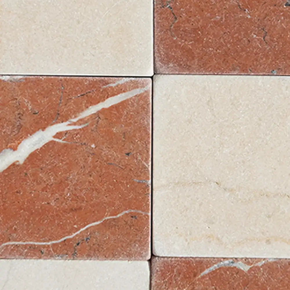 Red and cream marble tiles from Checkerboard Crema Marfil Select and Rojo Alicante Select