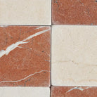 Red and cream marble tiles from Checkerboard Crema Marfil Select and Rojo Alicante Select