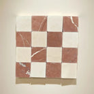 Checkerboard pattern of marble tiles in Crema Marfil and Rojo Alicante colors