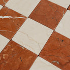 Checkerboard marble floor tiles with Crema Marfil and Rojo Alicante in 3x3 tumbled pattern