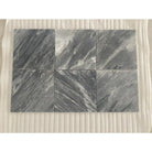 Six gray marble tiles from Checkerboard Diano Royal and Aurora White Marble set