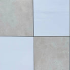 Four square tiles from Checkerboard Dolomite Prestige and Crema Marfil Select 12x12 set