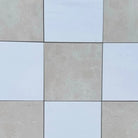 Checkerboard Bianco Dolomite and Crema Marfil 12x12 Tile Set with nine square tiles in a checkerboard pattern