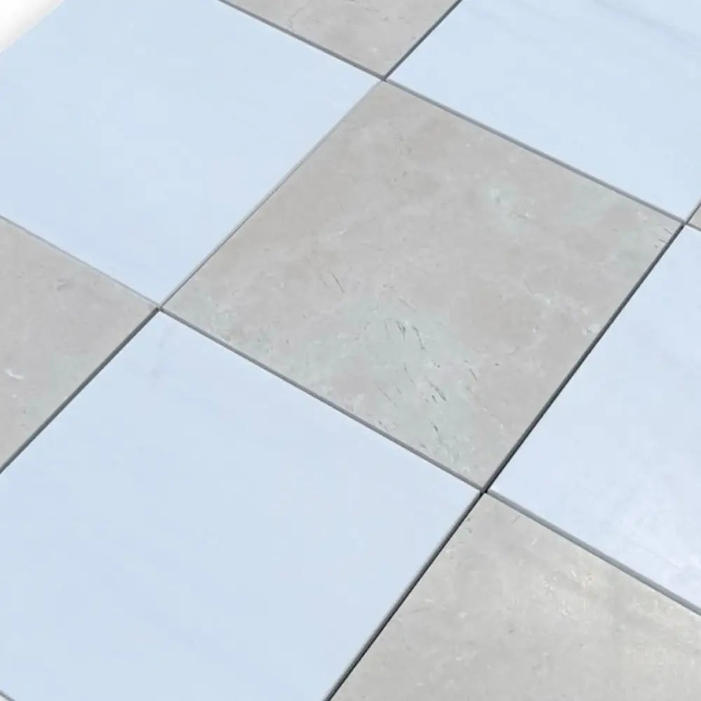 Checkerboard Bianco Dolomite and Crema Marfil 12x12 tile set with alternating light and dark squares