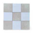 Checkerboard Bianco Dolomite and Crema Marfil 12x12 tiles arranged in a pattern